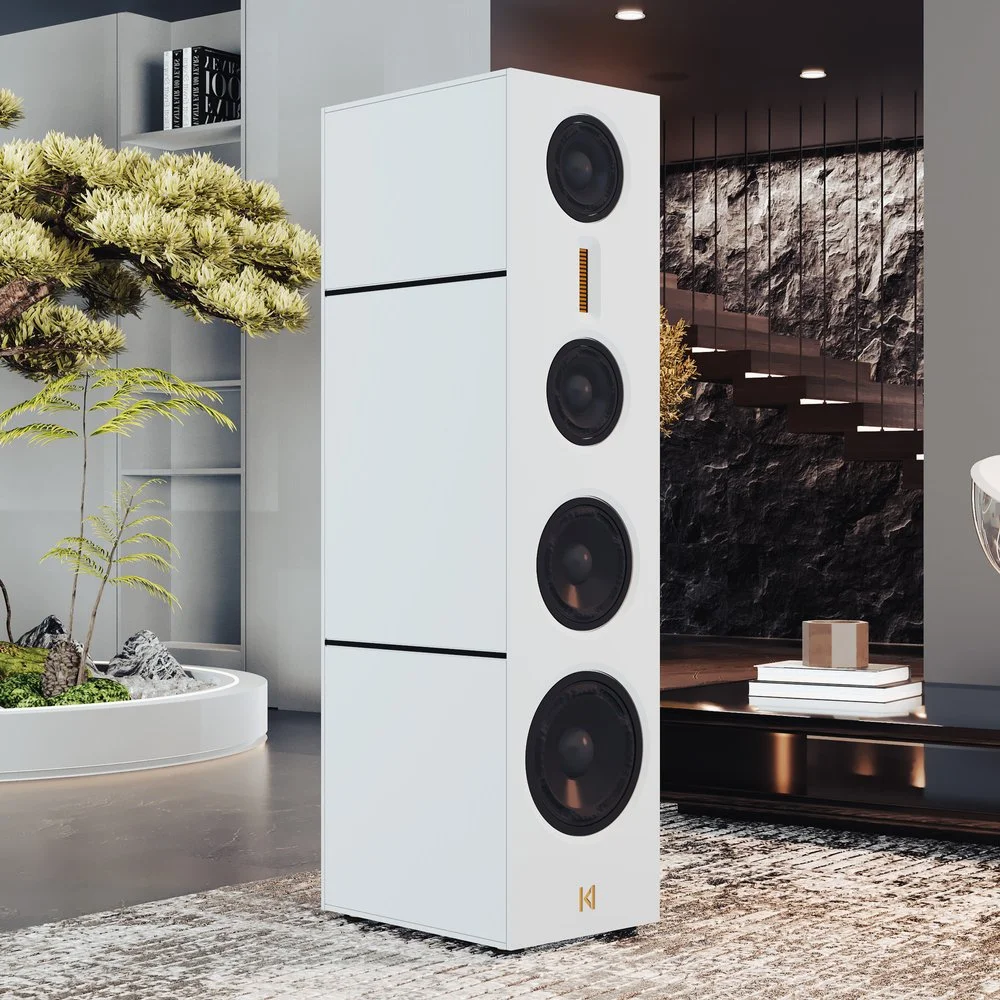The Kroma Matilde Loudspeaker pictured on a grey rug in front of a high-end staircase.